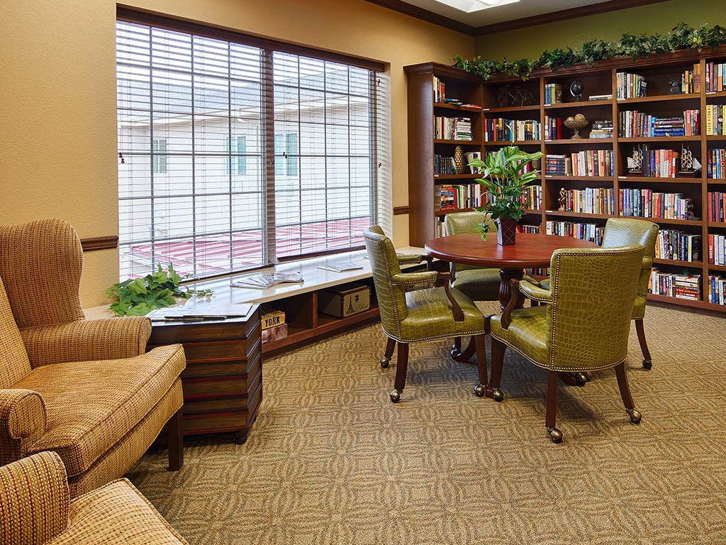 Cozy common area with bookshelves and seating