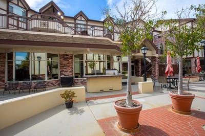 Outdoor patio area with seating and landscaping