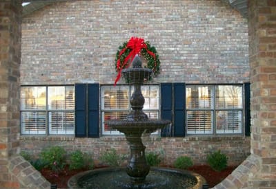 Outdoor fountain with a holiday wreath decoration