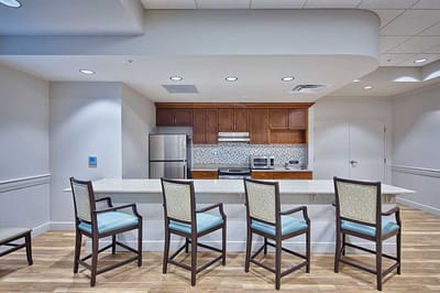 Interior kitchen area with bar seating and appliances