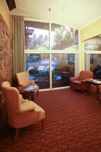 Cozy common area with comfortable seating and large windows