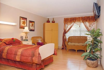 Cozy resident room with bed and seating area
