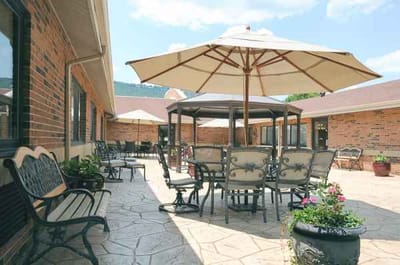 Outdoor patio area with seating and umbrellas
