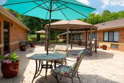 Outdoor patio area with umbrellas and chairs