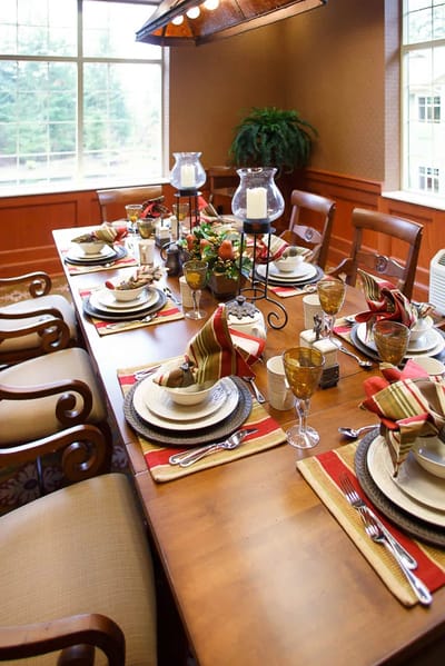 Beautifully set dining table in a common dining area