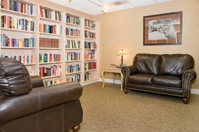 Cozy reading nook with bookshelves and seating