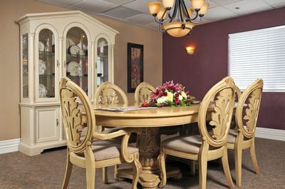 Elegant dining area with a wooden table and chandelier