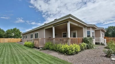 Exterior view of a senior living facility with landscaping