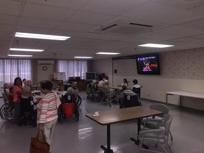 Residents participating in a group activity in the common area