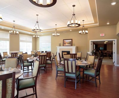Dining room with tables and chairs in a bright setting