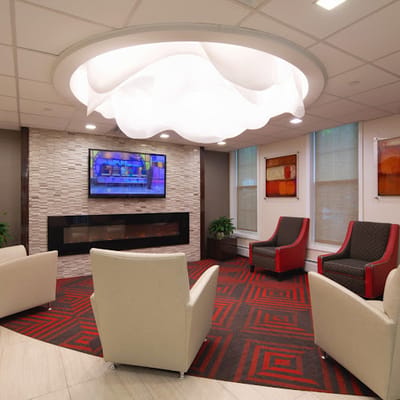 Bright and modern common area with seating and TV