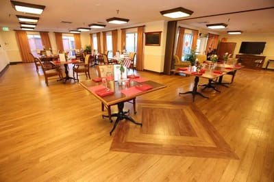 Dining room setup with tables and decorations