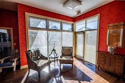 Bright sitting area with floral chairs and natural light