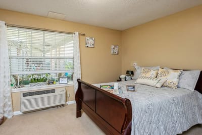 Cozy private resident room with decorative pillows