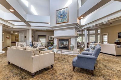 Bright common area with comfortable seating and fireplace
