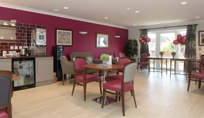 Bright common area with tables and chairs