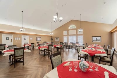 Dining area with neatly set tables and decor