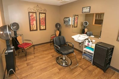 A well-lit hair salon space with styling chairs and mirrors