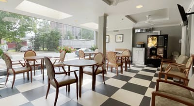 Bright dining area with tables and chairs