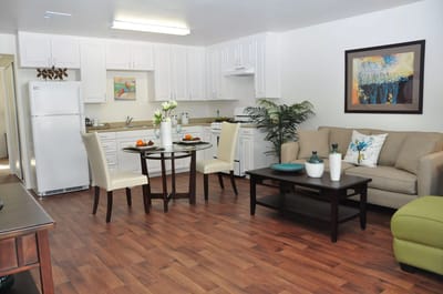 Well-decorated interior living space with kitchen
