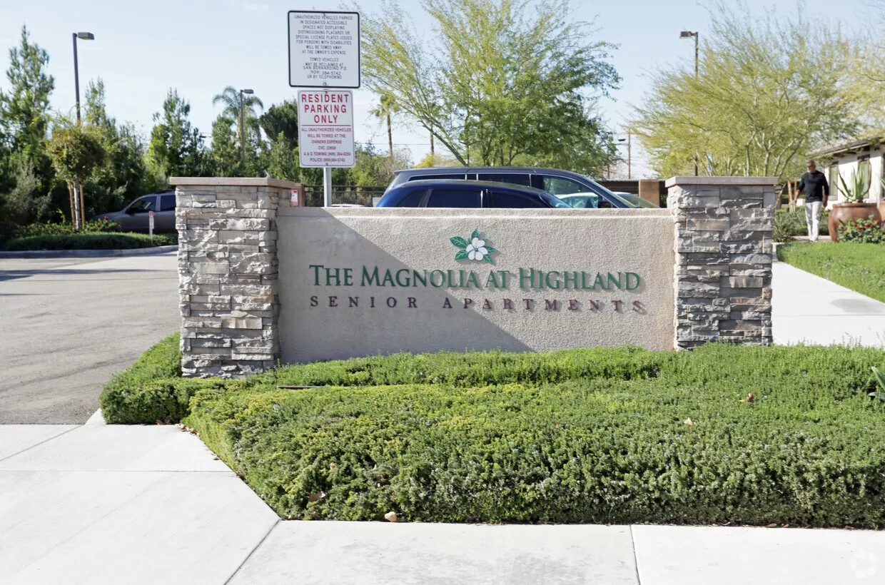 Sign for The Magnolia at Highland senior apartments