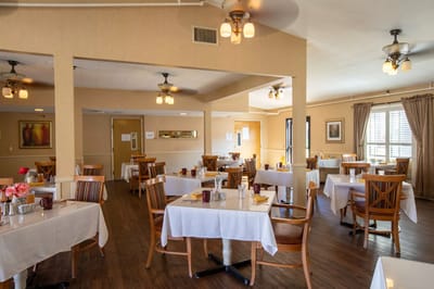 Dining room with tables set for meals