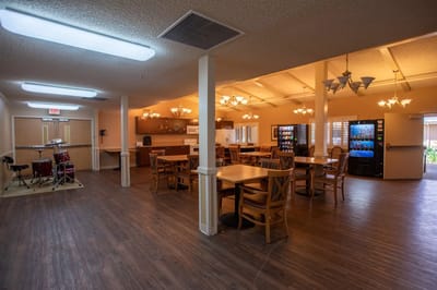 Common area with tables and a drum set