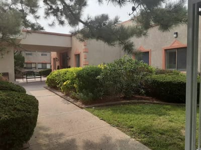 Lush garden and walkway at an assisted living facility
