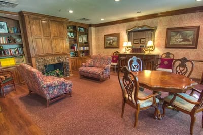 Cozy common area with seating and bookshelves