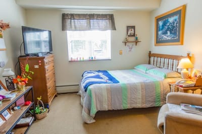 Cozy resident room with a bed and personal items