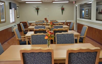 Bright dining room with tables and flower decorations