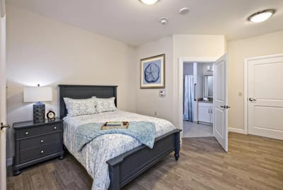 A well-furnished resident room with a cozy atmosphere