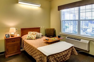 Cozy private resident room with a bed and natural light
