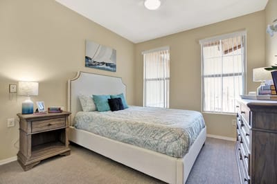 Cozy resident bedroom with natural light and decor