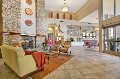 Interior view of a common area with seating and a fireplace