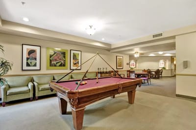 Interior view of a common area with a billiards table