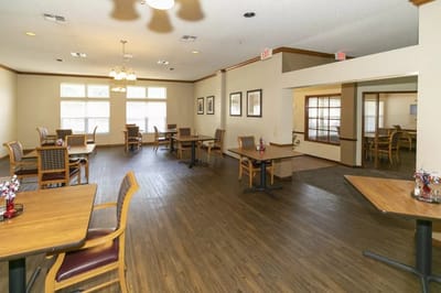 Dining area with tables and chairs in a bright interior