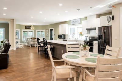 Bright, spacious common area with kitchen and dining space