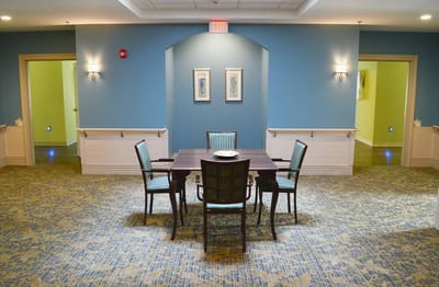 Bright common area with seating and artwork