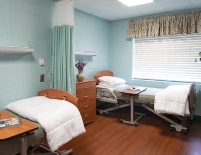 Cozy shared resident room with adjustable beds