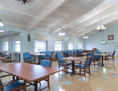 Interior view of a common area with tables and chairs