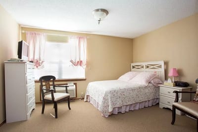 Cozy private room with bed and furniture