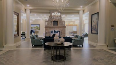 Elegant common area with a fireplace and seating.