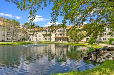 Pond view with building in the background