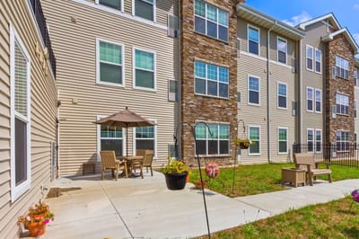 Outdoor patio area with seating and garden