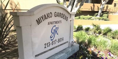 Sign with facility name in a landscaped area