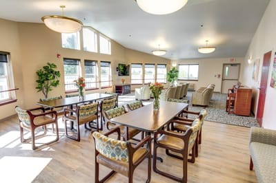 Bright common area with tables and chairs