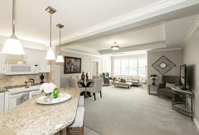 Bright and spacious living area of a resident's suite