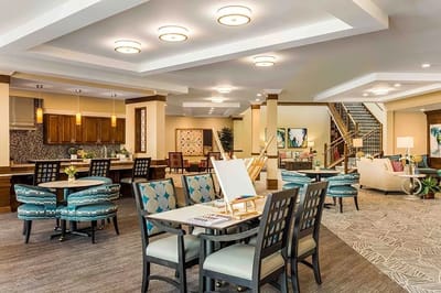 Bright common area with seating and art supplies