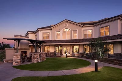 Exterior view of the facility with patio and garden
